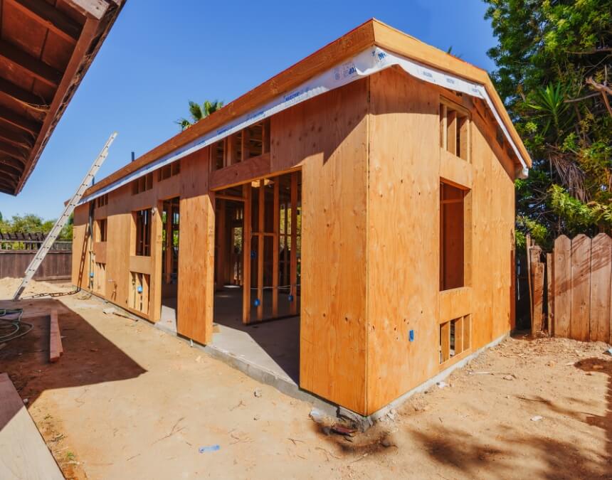 Finished backyard ADU next to primary residence, representing conclusion and future outlook for ADUs.