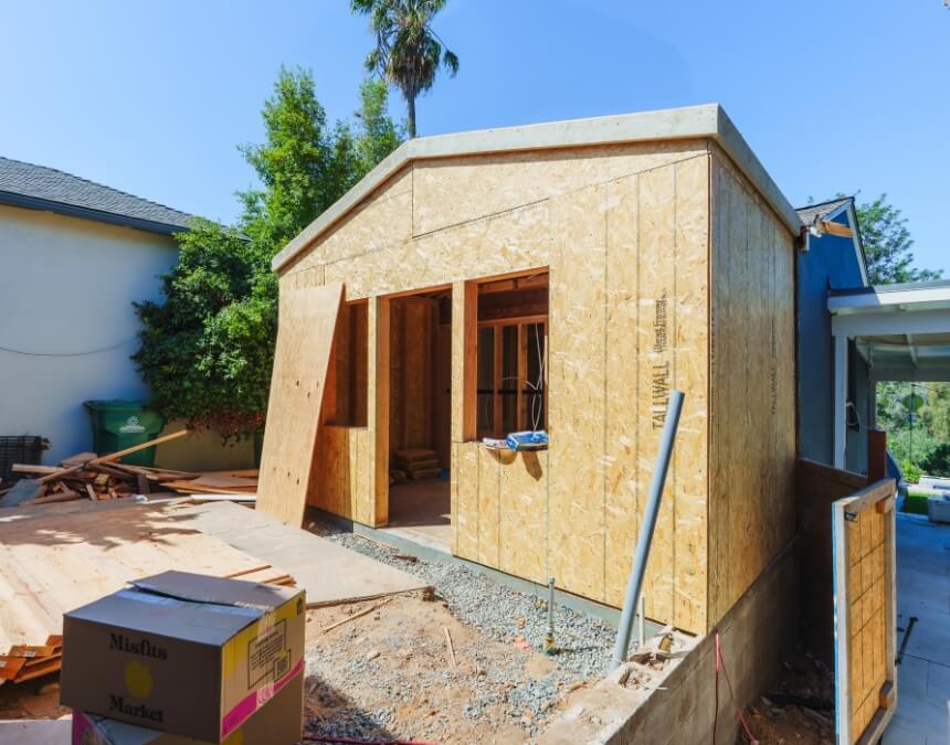 Key Construction Skills to Acquire for DIY ADU building showing interior framing, structural layout, and rough-in stages