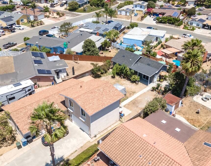 Understanding ADU Roofing Needs illustrated by an aerial view of multiple California ADUs with different roof types and layouts.