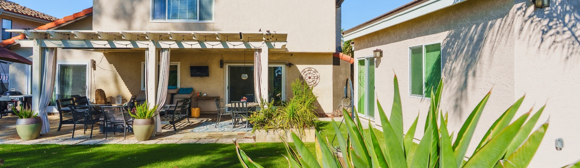 What Are the Best Loan Programs for ADUs in California (San Diego Guide) – finished backyard ADU setup beside a primary home.