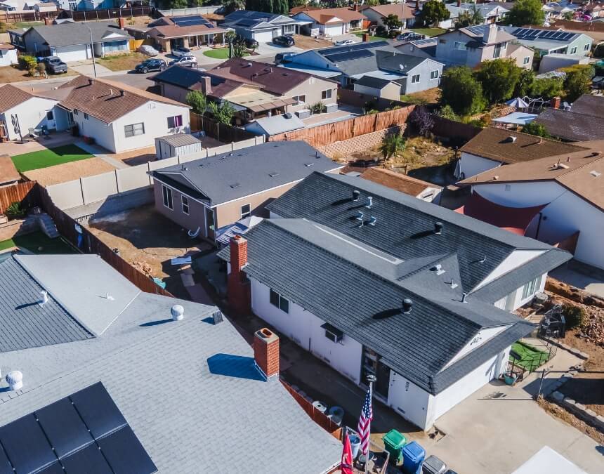 What Is an ADU, and Why Are They So Popular in California – aerial view showing a detached backyard cottage/ADU behind existing homes.