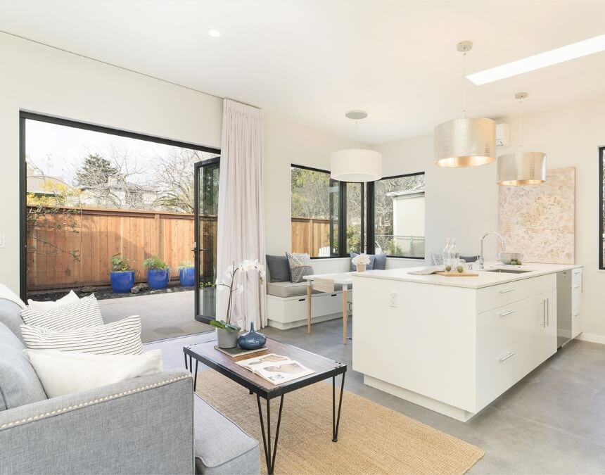 Designing Your Granny Flat modern ADU kitchen with green cabinets and space-efficient layout