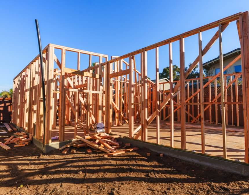 Framing stage of ADU construction showing potential building risks and delays